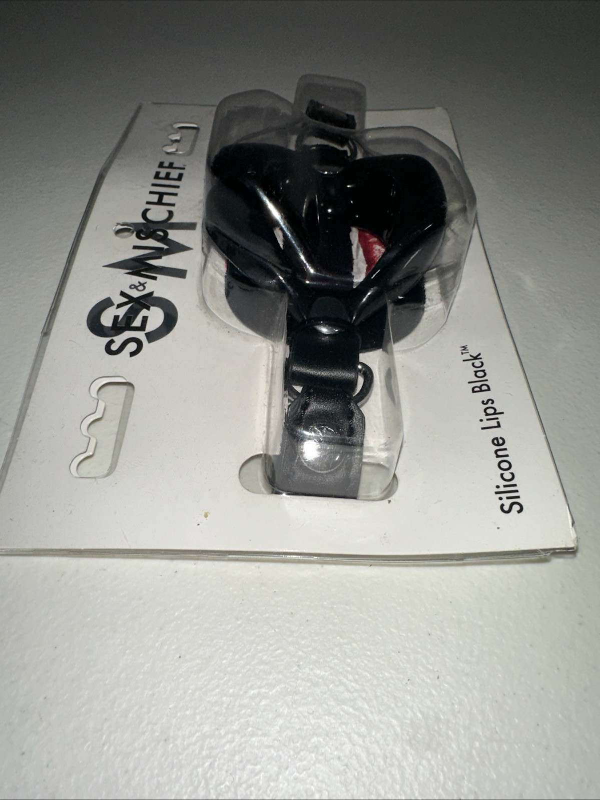 S&M Sex & Mischief Silicone Lip Black With Faux Leather Strap Black